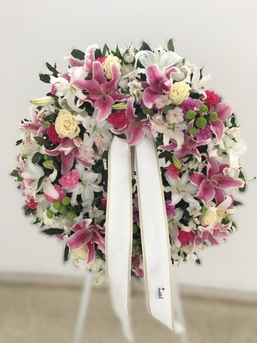 Corona de 70 cm de flores variadas tonos rosados